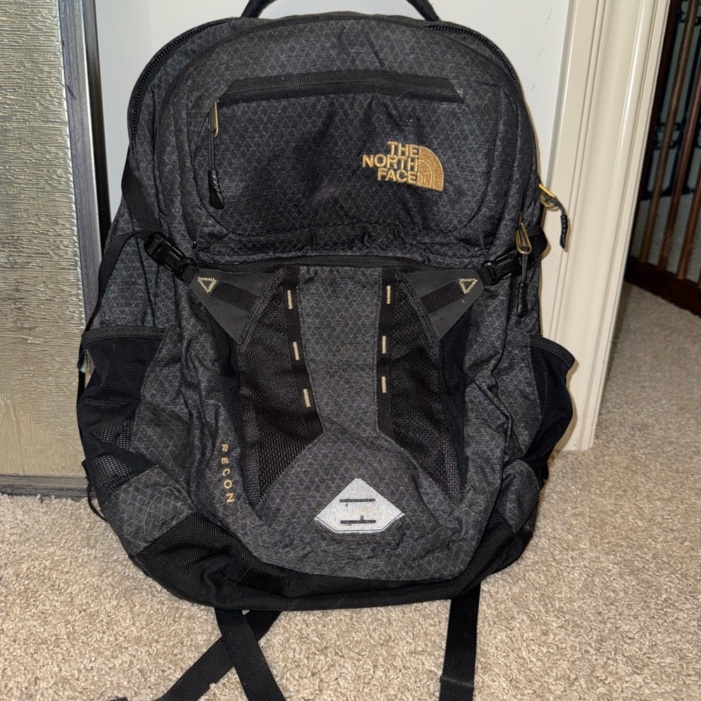 The North Face Black Backpack with Gold Accents